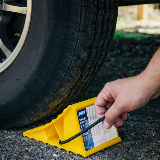 CAMCO 44472 Camco Standard Wheel Chock w/Rope for Trailers - Heavy Duty RV Wheel Chock Constructed of Durable Plastic w/UV inhibitors - Features Rope Handle for Easy Removal - Use w/Tires Up to 26-in - 44472
