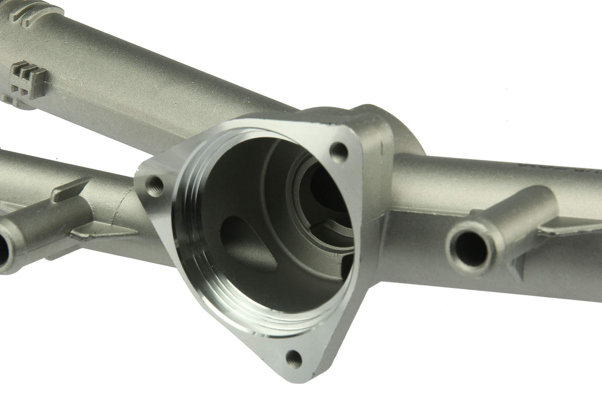URO Parts 03H121117A-PRM Thermostat Housing, HD aluminum vs OE plastic